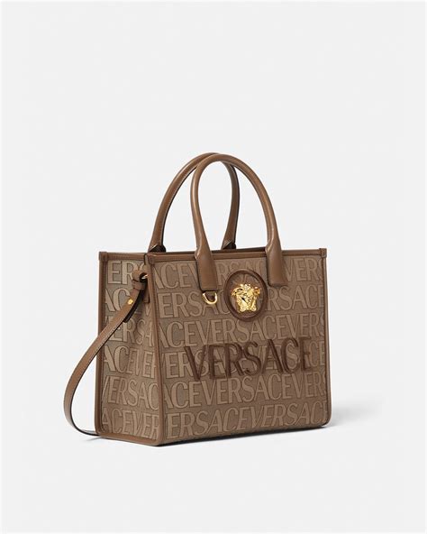 versace perfume metallic gold tone tote purse|Versace allover small tote bag.